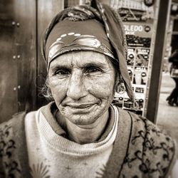 Portrait of mid adult woman in old man in city