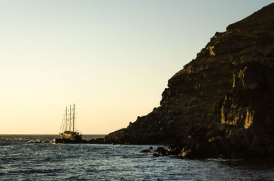 Sailboat on sea against clear sky