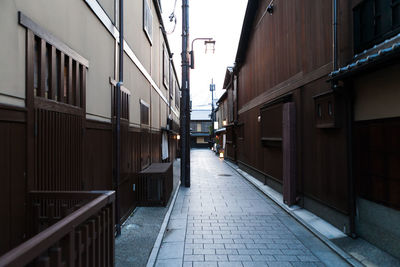 Alley amidst buildings in city