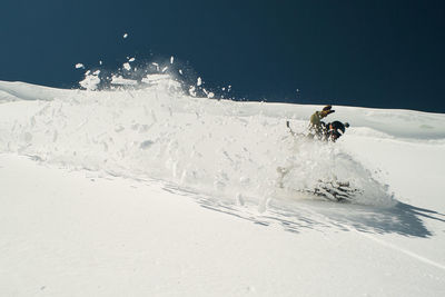 High angle view of person skiing on snowcapped mountain