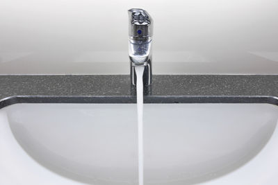 Close-up of faucet in bathroom