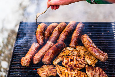 Cropped hand of person preparing food