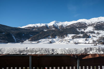 Scenic view of snowcapped mountains against clear sky