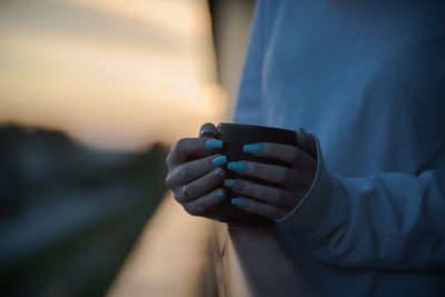 Close-up of man holding hand