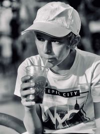 Portrait of a young man drinking glass