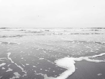 Scenic view of sea against sky during winter