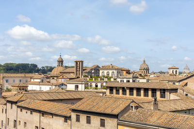 Buildings in city against sky