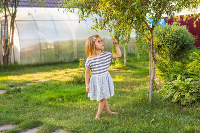 Full length of woman on grassy field