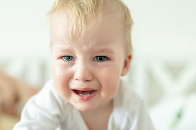 Portrait of cute baby boy crying