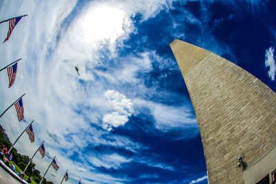 Low angle view of building against cloudy sky