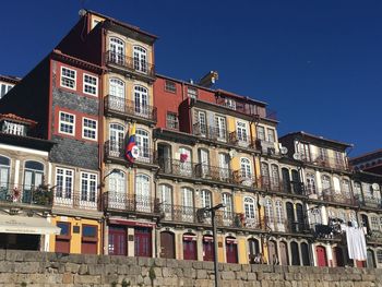 Low angle view of residential building against blue sky