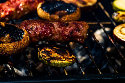 High angle view of meat on barbecue grill