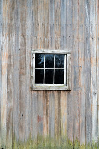 Low angle view of window on old building