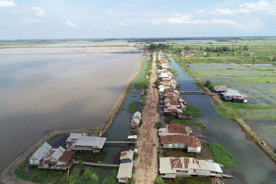 High angle view of houses and buildings against sky