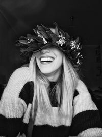 Portrait of young woman wearing hat