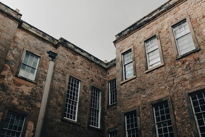 Low angle view of old building against sky