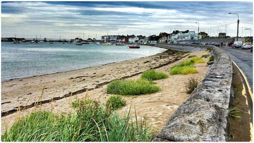 Scenic view of sea against cloudy sky