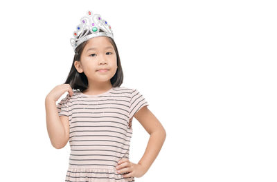 Portrait of a girl standing against white background