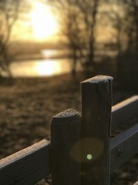 Close-up of water on table against sky during sunset