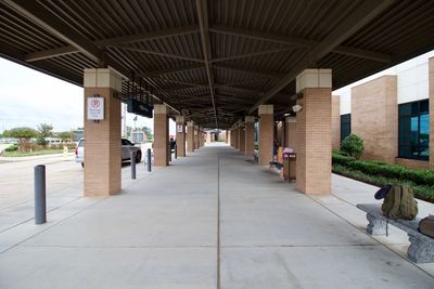 Empty benches in corridor of building