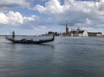 Boats in sea against sky