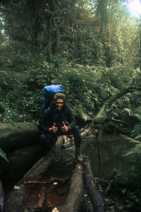 Man sitting in forest