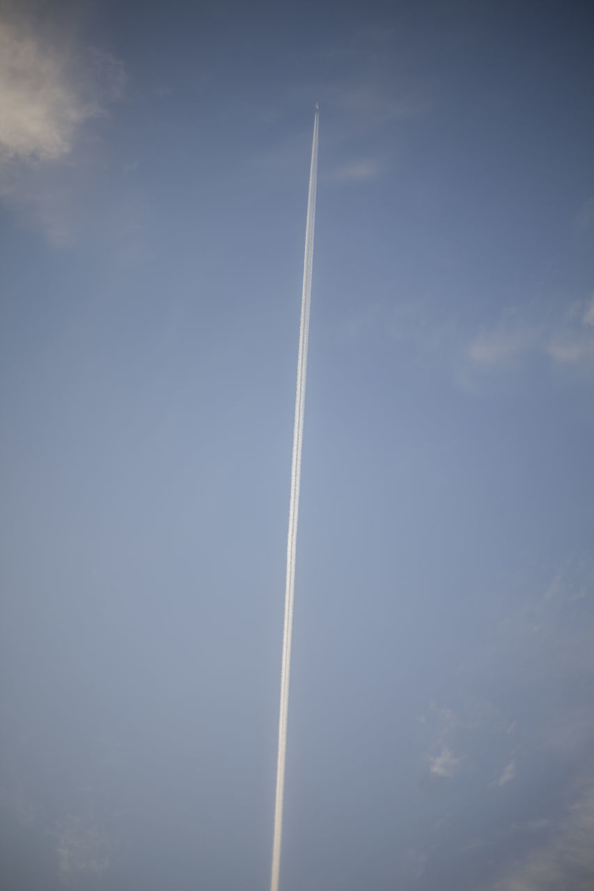 sky, cloud, vapor trail, air vehicle, nature, no people, low angle view, transportation, airplane, day, flying, line, outdoors, motion, mode of transportation, wing, beauty in nature, wind, smoke, travel