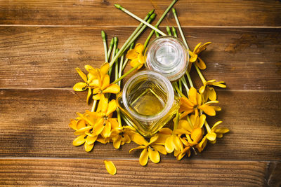 High angle view of various flowers in jar on table