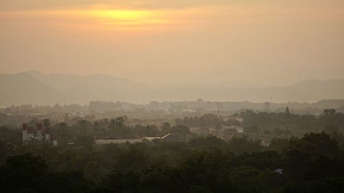 Scenic view of landscape against sky during sunset