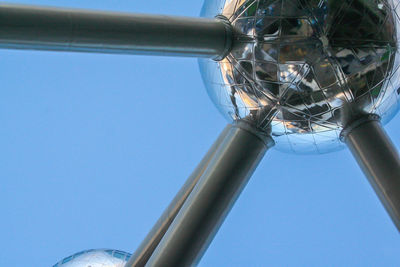 Low angle view of metallic structure against clear blue sky