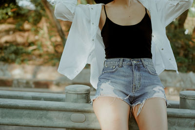 Low section of woman standing outdoors