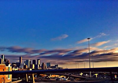 Illuminated cityscape against sky