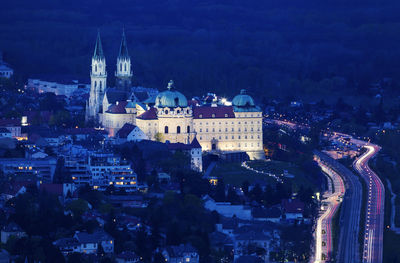 High angle view of illuminated buildings in city