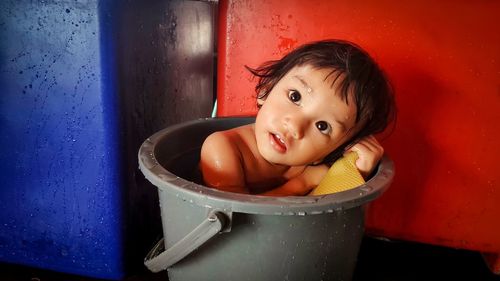 Portrait of cute girl in bath tub