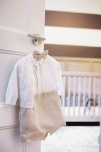 Clothes drying on white wall