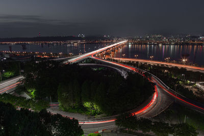 High angle view of light trails on road at night