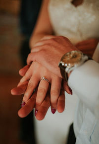 Midsection of woman holding hands