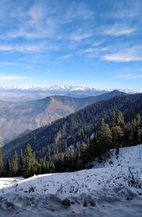 Scenic view of snowcapped mountains against sky