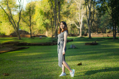 Portrait of young woman in park