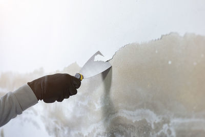 Cropped hand of person holding water