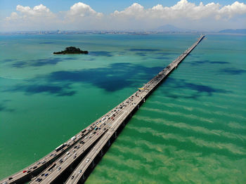 High angle view of bridge over lake against sky