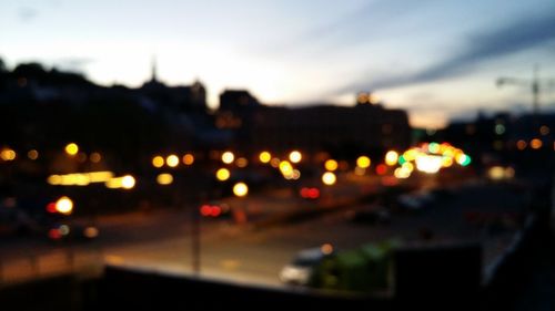 Defocused image of illuminated city at night