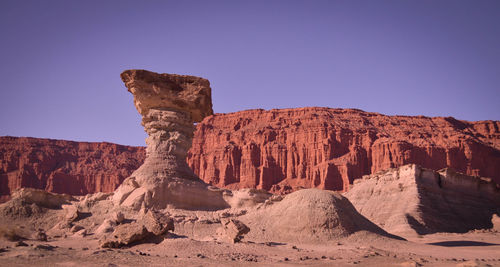 Rock formations in desert against clear sky