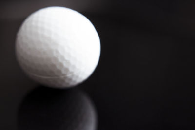 Close-up of ball against black background