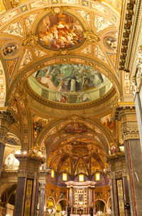 Low angle view of illuminated ceiling of building