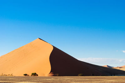 Scenic view of desert against clear sky