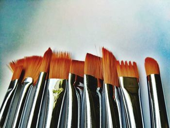 Close-up of various paintbrush on table