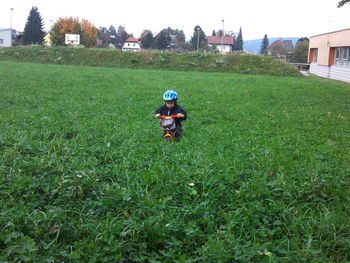 Girl standing on grassy field