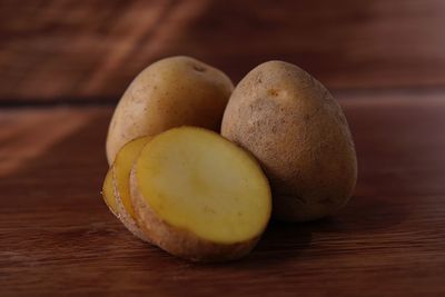 Close-up of potatoes on wooden table