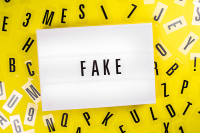 Full frame shot of yellow information sign